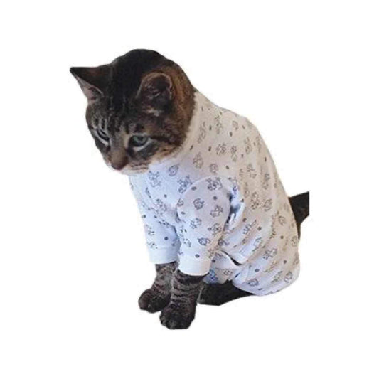 A Tabby cat is wearing the Cover Me by Tui Cat Cone Alternative in kitty print