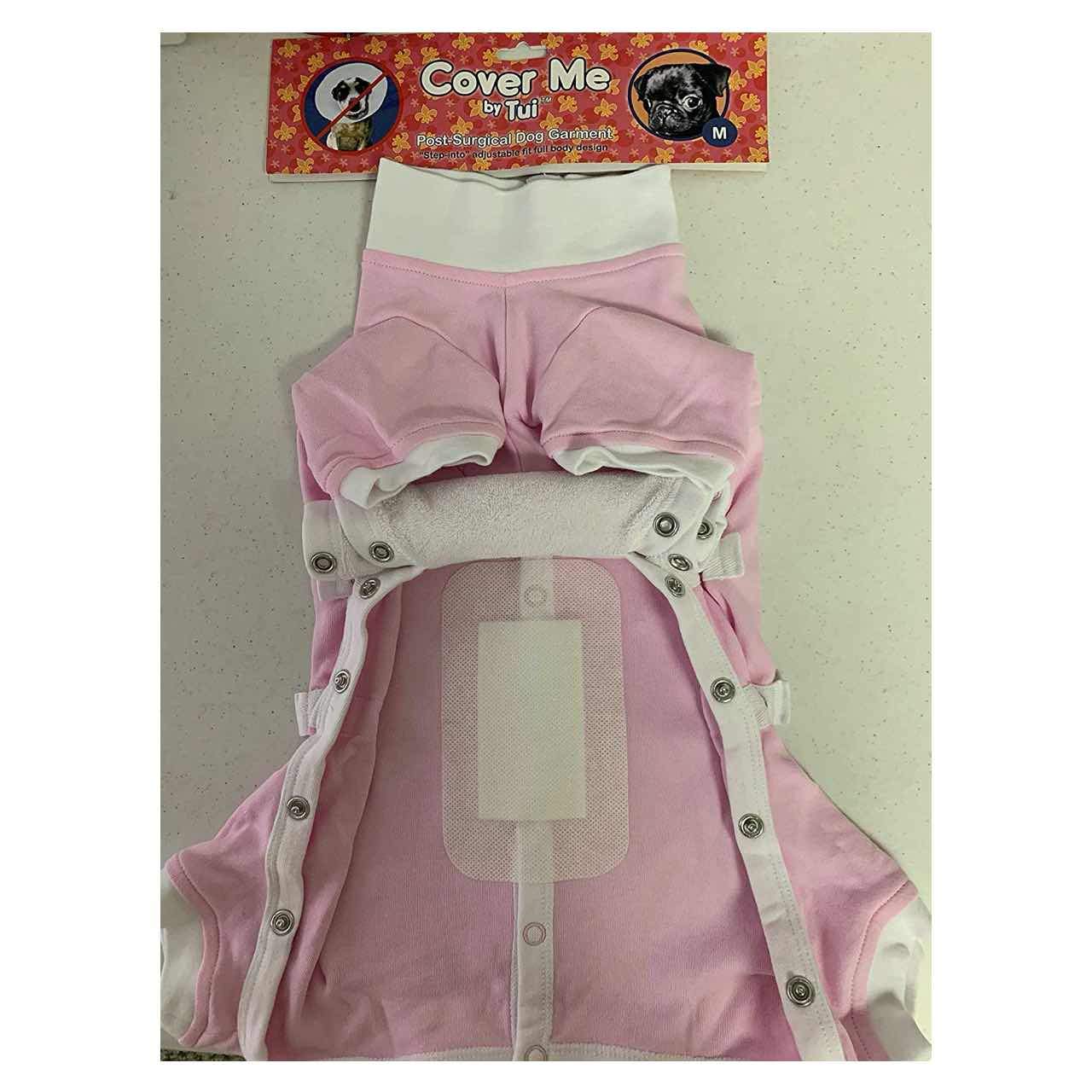 A large Cover Me Bandage for Dogs and Cats stuck to the inside of a pink pet recovery suit